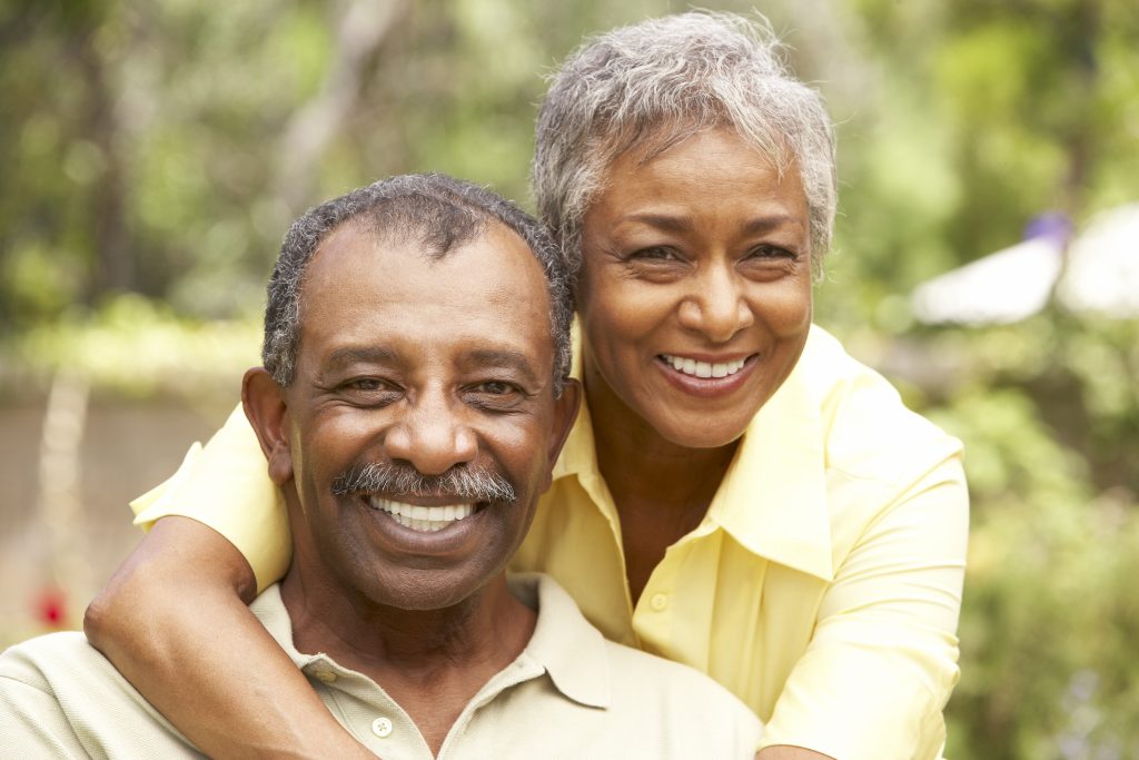 Senior Couple Relaxing In Garden