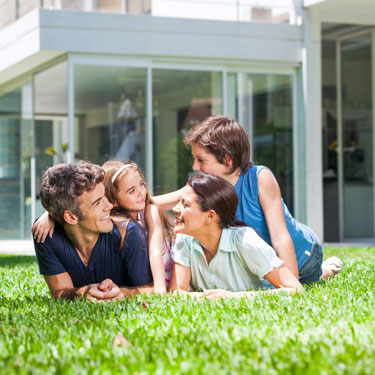 Family Laying in the Yard